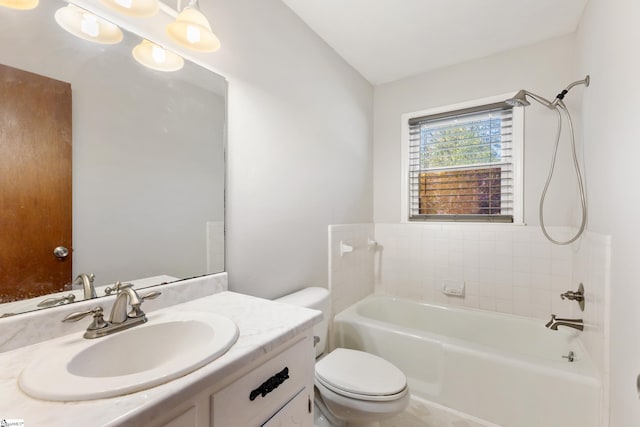 full bathroom featuring bathing tub / shower combination, vanity, and toilet