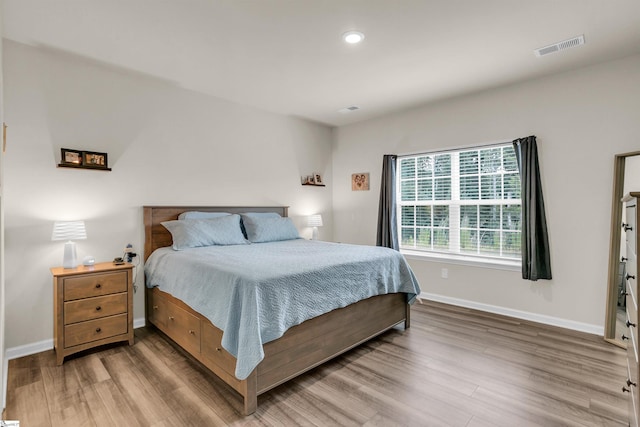 bedroom with hardwood / wood-style floors