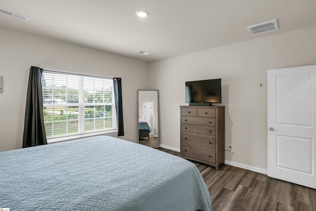 bedroom featuring dark hardwood / wood-style flooring