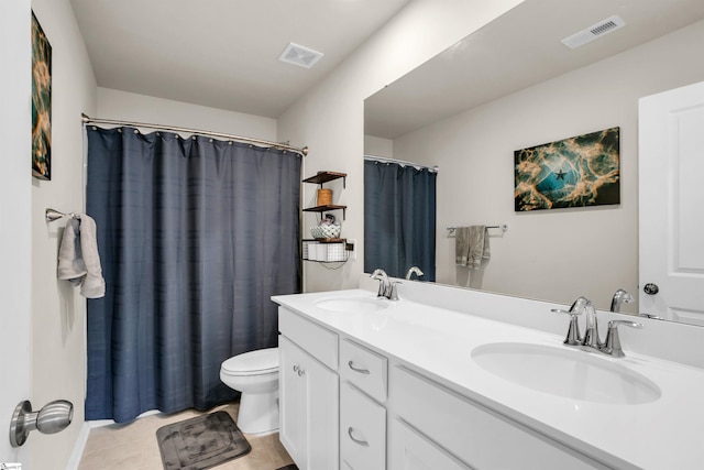 bathroom featuring walk in shower, vanity, tile patterned flooring, and toilet