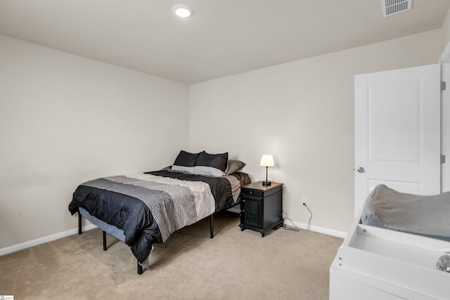 bedroom featuring light colored carpet