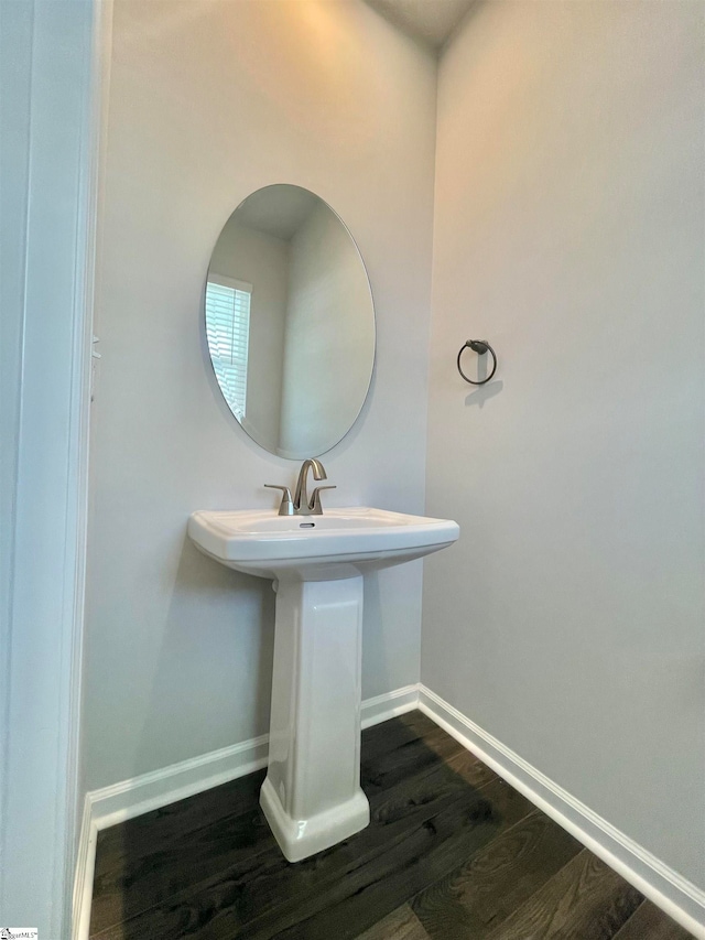 bathroom with wood-type flooring