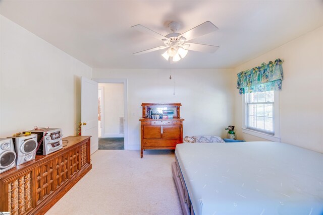 bedroom with light carpet and ceiling fan