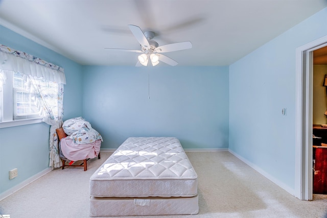 bedroom with ceiling fan and carpet