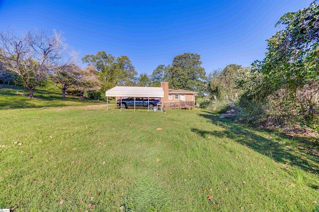 view of yard with a carport