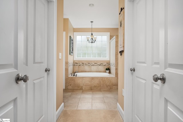 bathroom with ornamental molding, tile patterned floors, a relaxing tiled tub, and a chandelier