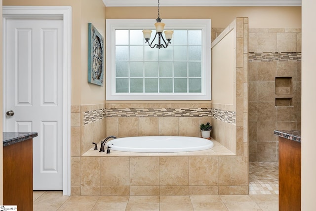 bathroom featuring an inviting chandelier, shower with separate bathtub, tile patterned floors, and vanity