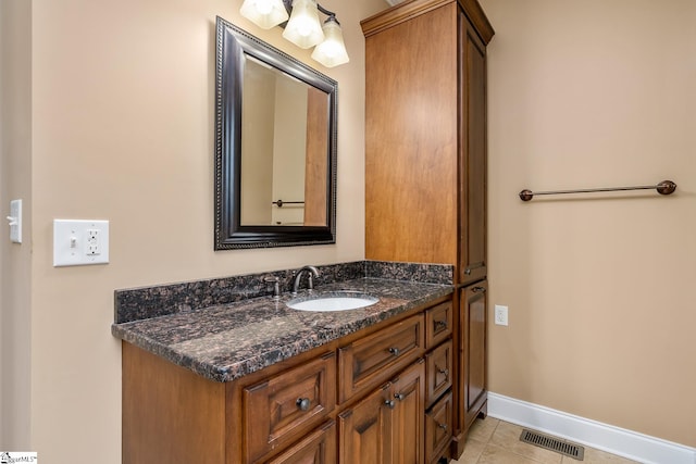 bathroom with tile patterned floors and vanity