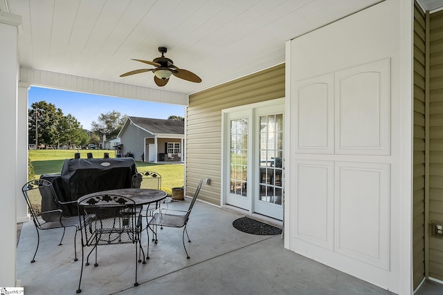 view of patio featuring ceiling fan