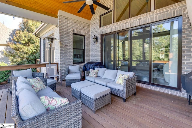 deck featuring outdoor lounge area and ceiling fan