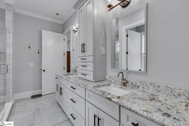 bathroom featuring vanity, tile patterned flooring, ornamental molding, and a shower with door