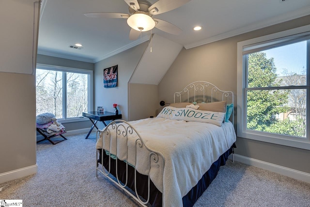 bedroom featuring multiple windows, ceiling fan, crown molding, and carpet flooring