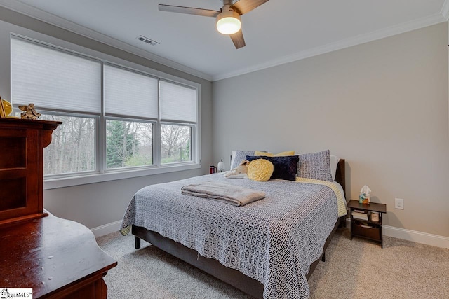 bedroom with ornamental molding, light carpet, and ceiling fan