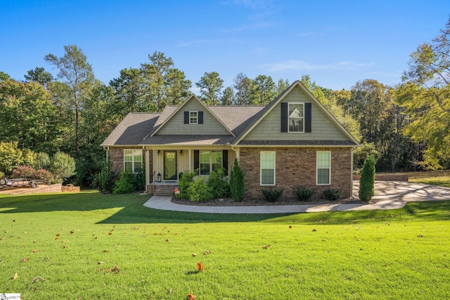 craftsman inspired home with a porch and a front lawn