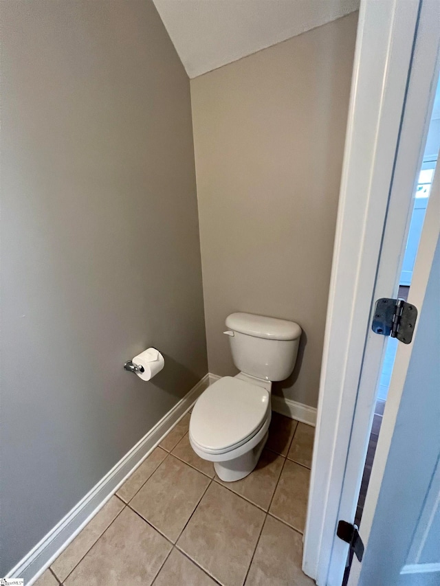 bathroom featuring tile patterned flooring and toilet