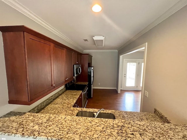 kitchen featuring ornamental molding, sink, kitchen peninsula, stainless steel appliances, and dark hardwood / wood-style floors