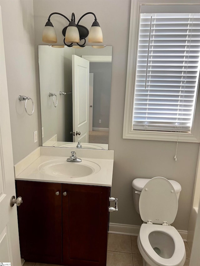 bathroom featuring vanity, toilet, and tile patterned floors