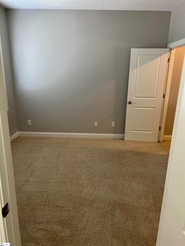 empty room with carpet flooring