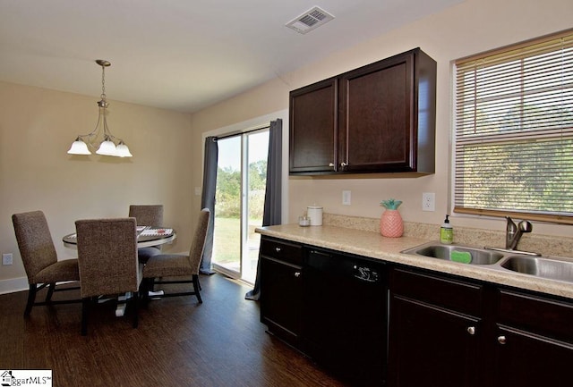 kitchen with an inviting chandelier, dark hardwood / wood-style flooring, sink, dishwasher, and hanging light fixtures