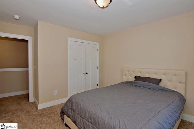 carpeted bedroom featuring a closet