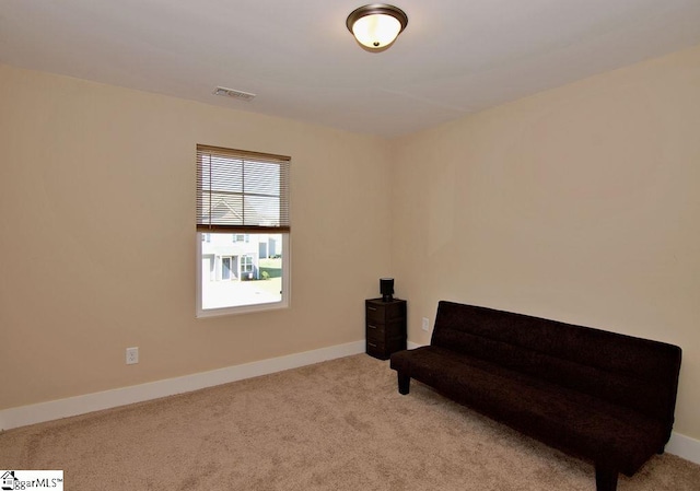 unfurnished room with light colored carpet