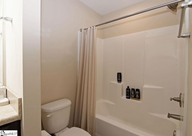 full bathroom with shower / bath combo, vanity, and toilet