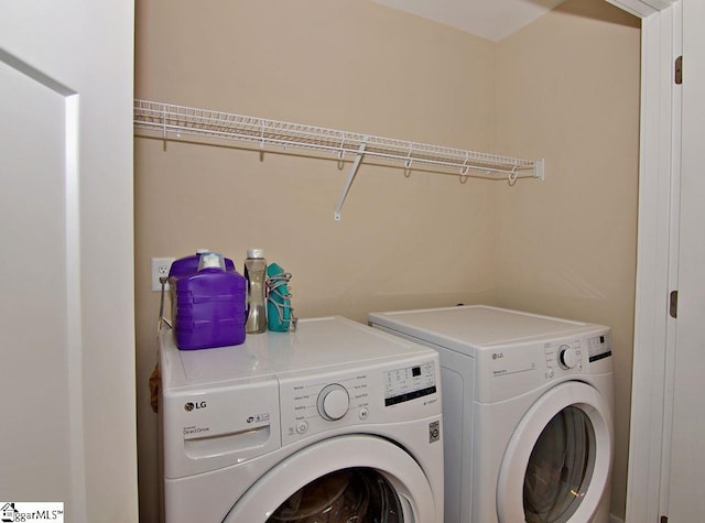 laundry room with washer and clothes dryer