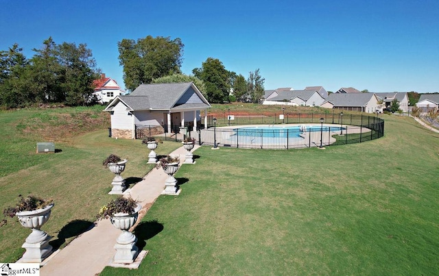 view of pool with a yard and a patio