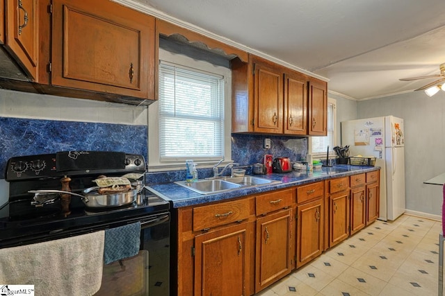 kitchen featuring white refrigerator, black range with electric stovetop, sink, backsplash, and ornamental molding