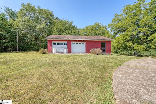 garage with a yard