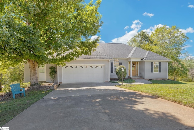 view of front facade with a front lawn and a garage