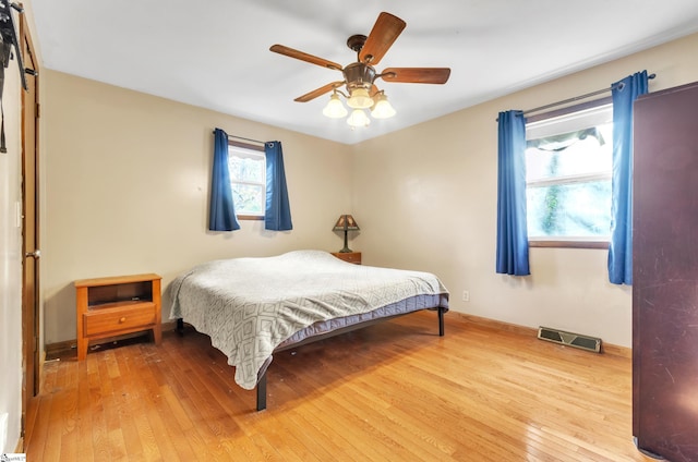 bedroom featuring ceiling fan and hardwood / wood-style floors