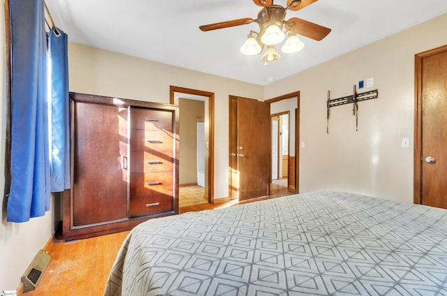 bedroom featuring light hardwood / wood-style floors and ceiling fan