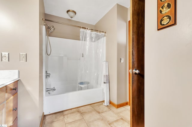 bathroom with tile patterned flooring, vanity, and shower / bath combo with shower curtain