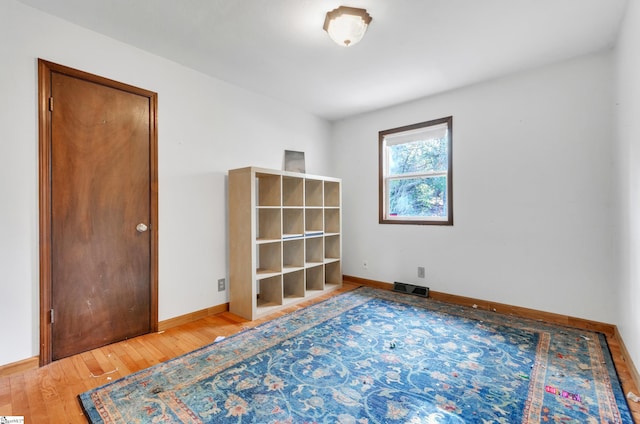 empty room featuring hardwood / wood-style flooring