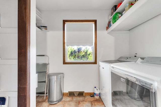 laundry room featuring light tile patterned floors and independent washer and dryer