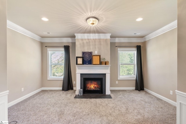 unfurnished living room featuring a healthy amount of sunlight, crown molding, and light colored carpet