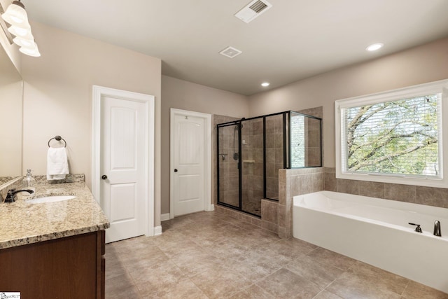 bathroom with vanity, tile patterned flooring, and separate shower and tub