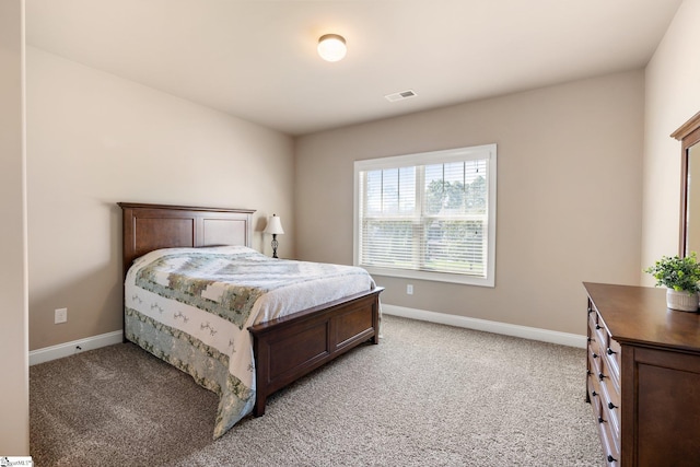 bedroom with light carpet