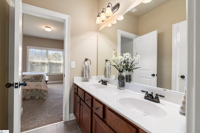 bathroom featuring tile patterned flooring and vanity