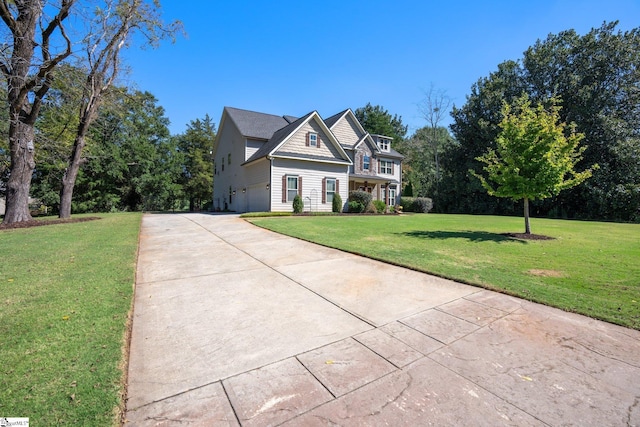 view of front of house with a garage and a front lawn