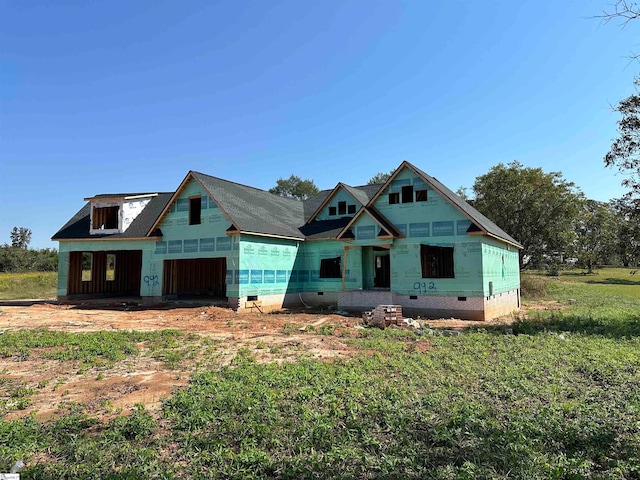 property in mid-construction featuring a front lawn