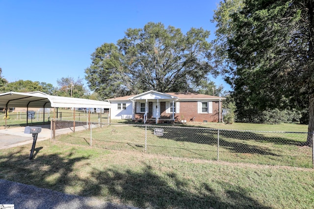 view of front facade with a front yard and a carport