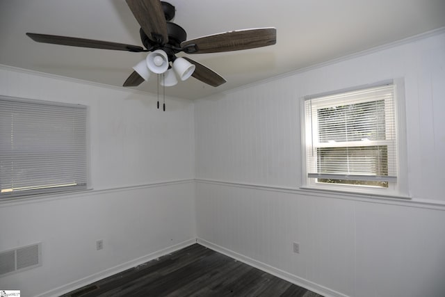 645 Woodvale Rd, Anderson, SC 29624 - unfurnished room with crown molding, dark wood-style flooring, ceiling fan, and visible vents