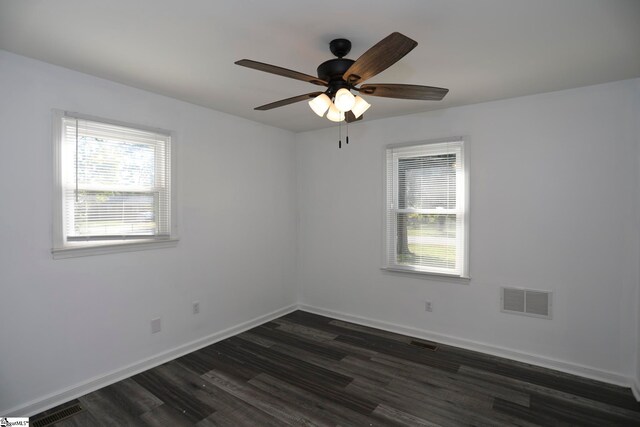 unfurnished room with dark wood-type flooring and ceiling fan