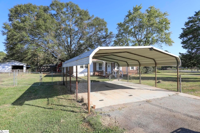 view of parking with a yard and a carport