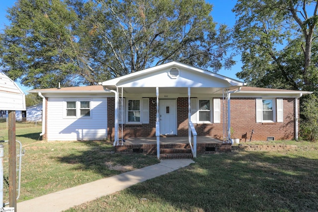 bungalow-style home featuring a porch and a front yard