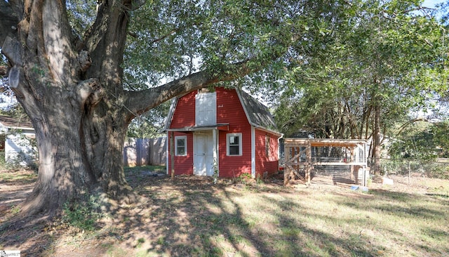 view of outdoor structure with a lawn