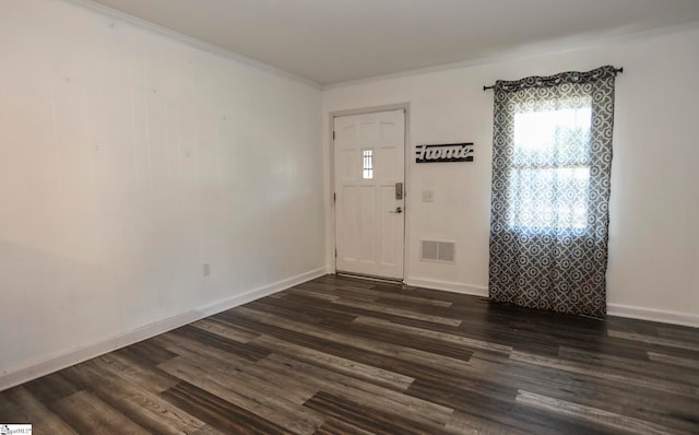 entrance foyer featuring crown molding and dark hardwood / wood-style floors