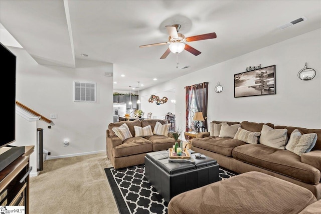 living room featuring ceiling fan and light colored carpet